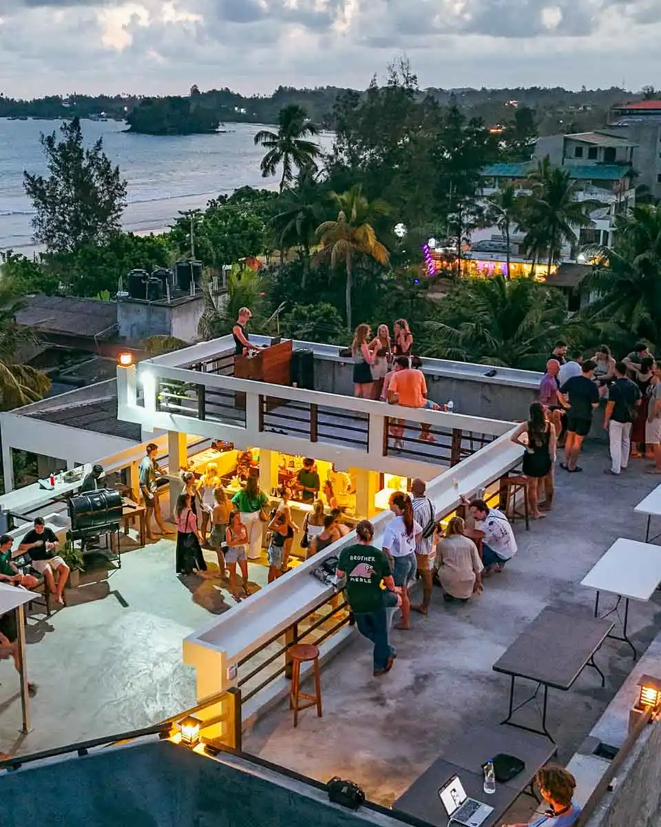 Drone aerial view of the rooftop and bay at golden hour